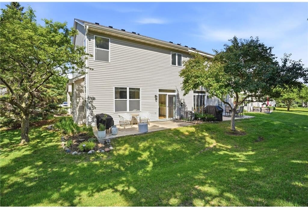 Private backyard with patio and mature trees